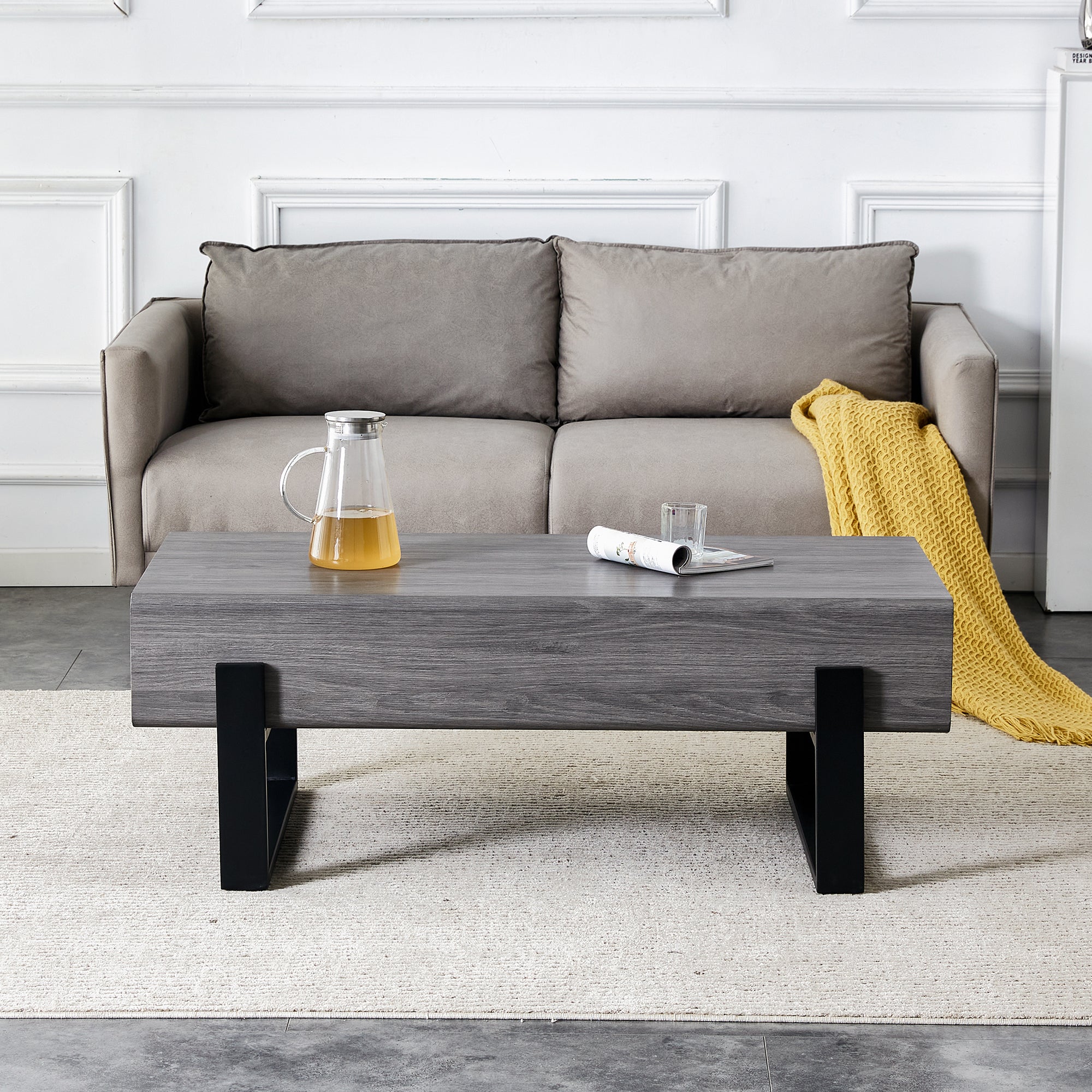 A coffee table made of MDF material. Equipped with drawers made of solid wood material. Can store things and save space. Paired with black metal table legs. Suitable for living room.