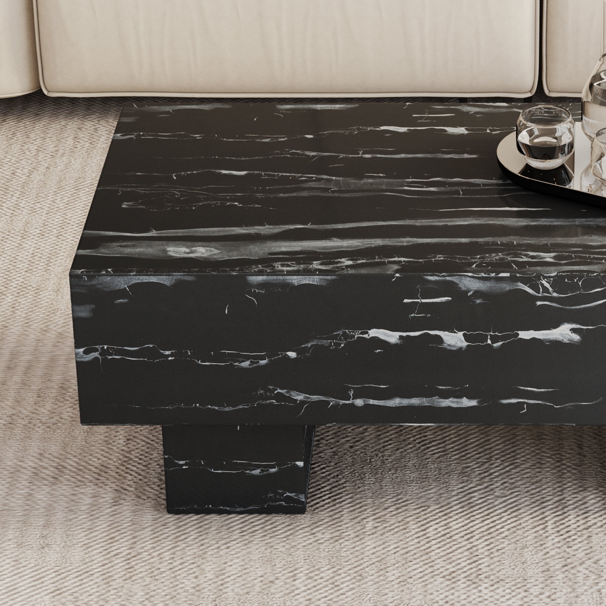 The black coffee table has patterns. Modern rectangular table, suitable for living rooms and apartments. 43.3"*21.6"*17.2"