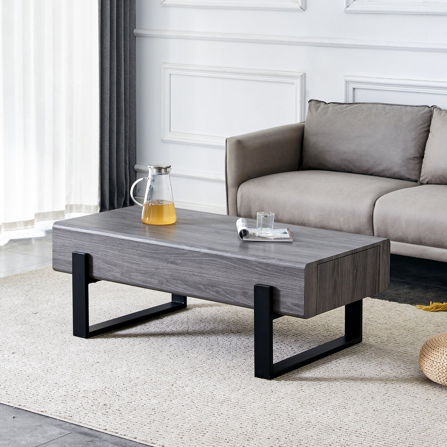 A coffee table made of MDF material. Equipped with drawers made of solid wood material. Can store things and save space. Paired with black metal table legs. Suitable for living room.